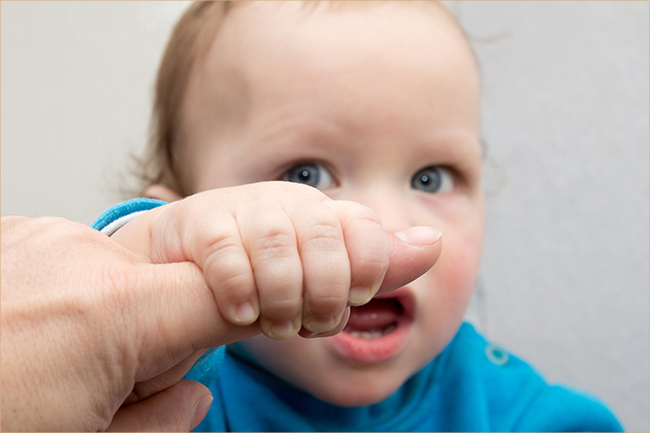 Baby grabbing finger